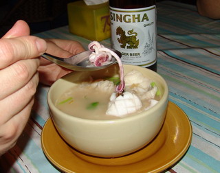     - Rice soup with sea food.    - Singha beer